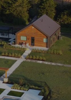 Three private retreats at Element Ranch with a shared pool and beautiful natural surroundings, offering a peaceful escape for all guests. Element Ranch Retreats featuring three private luxury retreats, a sparkling shared pool, and lush landscaping in a tranquil setting.